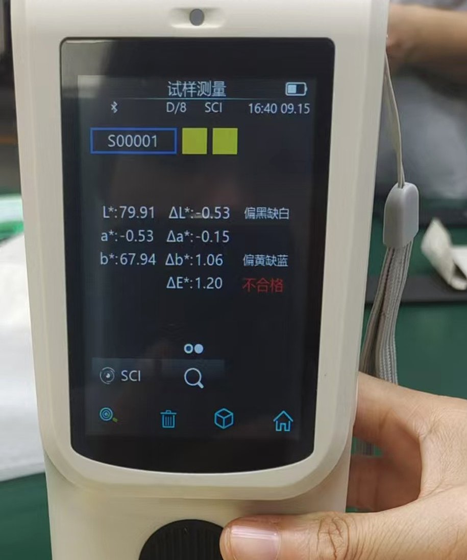 Close view of a handheld colour meter screen showing the mode D/8 SCI, the stored standard identifier S00001, and readings to two decimal places ending in a Delta E of 1.20 marked as failing